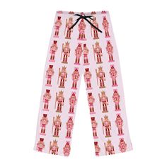 Pink nutcracker pajama pants that are made from soft 100% polyester jersey material. These pants feature a bright and crisp all-over print design with double needle stitching on all seams for durability. The drawstring waist allows for a perfect fit, while the relaxed comfort fit and back elastic make them ideal for relaxing at home during the holiday season. Product features - 100% polyester jersey material - All-over print design - Double needle stitching for durability - Adjustable drawstring Pajama Pants Christmas, Pink Nutcracker, Women's Pajama Pants, Cozy Sleepwear, Womens Pajamas Pants, Christmas Pjs, Sleep Shorts, Mens Long Sleeve Tee, Limassol