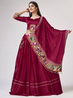 Introducing our amazing maroon gamthi work silk navratri wear lehenga choli, made with maroon satin silk material. This stunning ensemble is perfect for traditional occasions like Navratri, where you want to look elegant and festive.
Let's talk about the benefits of this beautiful lehenga choli. It is made with high-quality satin silk material, ensuring a smooth and comfortable fit. The maroon color adds a touch of sophistication and grace to the overall look. The gamthi work on the choli and at Satin Silk Lehenga, Gamthi Work, Chaniya Choli Designs, Silk Lehenga Choli, Navratri Dress, Lengha Choli, Choli Designs, Ghagra Choli, Bridesmaid Outfit