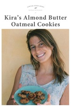 a woman holding a plate of food with the words, kira's almond butter oatmeal cookies