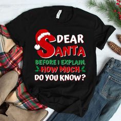 Explain Yourself to Santa with Our Funny “I Can Explain” Christmas Shirt Get ready to plead your case to the big man in red with our hilarious Santa I Can Explain Funny Christmas Shirt. This witty design is perfect for those who might find themselves on the naughty list but still have hope for redemption! [...] Funny Black Christmas T-shirt, Black Christmas Tops With Text Print, Black Tops With Text Print For Christmas, Black Text Print Top For Christmas, Santa Tshirt, Santa I Can Explain, I Can Explain, Christmas T Shirt Design, Photographer Shirts