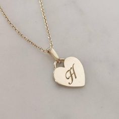 Monogram heart necklace. Vintage style heart pendant engraved with your initial. A perfect gift to be cherished forever.   Heart pendat: 11 mmPendant thickness: 1 mmNecklace length: 45 cm* Available in 14K or 18K YELLOW, WHITE and ROSE gold.price listed is for 14K gold (for 18k pricing please contact me)* Available in either shiny or matte finish. Please choose your preferred finish upon checkout.* Please mention the initial you would like engraved in "note to seller" * For a longer necklace (50 Heart Pendant Monogram Jewelry For Anniversary, Heart Pendant Charm Necklace With Initials For Anniversary, Initials Charm Necklace With Heart Pendant For Anniversary, Classic Initial Pendant Charm Necklace For Anniversary, Classic Necklaces With Initial Pendant For Anniversary, Classic Necklaces For Anniversary With Initial Pendant, Personalized Heart Pendant Initial Necklace, Anniversary Heart Pendant Charm Necklace With Initials, Sterling Silver Initial Necklace With Heart Charm