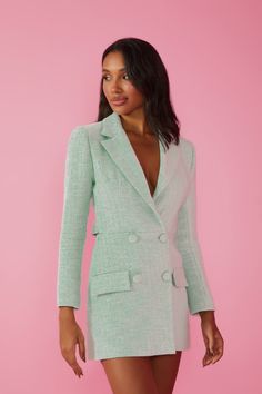 Mint green tweed blazer dress featuring a V-neck, long sleeves, collar, lapel, unique back opening, and front button closure. An elegant and versatile piece to add a pop of color to your wardrobe. Crafted from high-quality tweed, it boasts a vibrant shade of mint green for a fresh touch to your looks. With a neckline that enhances the collar, long sleeves, and front button closure, this blazer dress is versatile enough for both formal occasions and casual events. The collar and lapel add a class Elegant Fitted Green Tweed Dress, Spring Long Sleeve Dresses With Double Button Closure, Spring Dresses With Long Sleeves And Double Button Closure, Chic Green Fitted Tweed Dress, Elegant Green Long Sleeve Blazer Dress, Chic Long Sleeve Tweed Dress With Button Closure, Elegant Green Blazer Dress For Spring, Fitted Green Blazer Dress For Fall, Fitted Green Tweed Dress For Fall