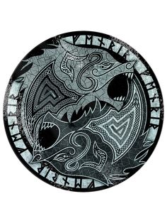 a black and white plate with designs on it