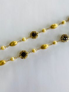 "This is a vintage 18K (high-karat) yellow gold, brown/smokey topaz, and pearl necklace. The necklace pattern alternates from a smooth-textured gold beads, to pearls, to ornately gold-wrapped brown/smokey topaz. Material(s): 18K yellow gold + pearl + brown/smokey topaz Total weight: 45 grams Flaws (if any): None to mention Marking(s): \"750\" (translating to \"18K\") + \"Italy\" Measurements: This necklace measures 23 1/2 (or 23.5) inches in length. If you have any questions about this necklace, Pearl Cluster Necklace, Brown Smokey, Smokey Topaz, Italy Vintage, Gold Wrap, Necklace Patterns, Pearl Cluster, Cluster Necklace, Gold Texture