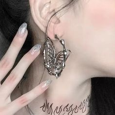 𝔇𝔢𝔱𝔞𝔦𝔩𝔰: Style: Goth, Fairy grunge, Y2k Materials: Titanium Steel Quantity: 1 pair This is a pair of fairy grunge-style earrings, featuring a butterfly design in a hoop shape Solid durable material, perfect for all kinds of looks Enjoy free shipping with a purchase of over 80$ Silver Emo Earrings For Parties, Trendy Silver Halloween Earrings, Silver Metal Emo Earrings, Silver Metal Emo Style Earrings, Silver Emo Style Earrings, Silver Fairy Grunge Earrings For Gift, Silver Fairycore Earrings For Party, Fairy Grunge Silver Earrings For Gift, Fairy Grunge Dangle Earrings