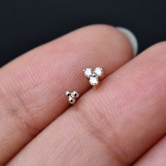 "Buy a set and save! A set of 2 (choose from single or pairs) tiny minimal stud earrings. Perfect for multiple ear piercings as well as nose piercing! Each piece is subtle, unique, and perfect for everyday. 1) GOLD BALL TRINITY * Size : 2.5-3 mm * Gold - 14K Solid Gold 2) DIAMOND TRINITY * Size : 4 mm * Gemstone : Natural Diamond * Diamond Wt : 0.04 ct * Color / Clarity : H-I, Vs-Si * Gold - 14K Solid Gold * Standard length of the post below the diamond collet is 6-7mm. It can be adjusted as per Tiny Round Cartilage Earrings For Anniversary, Minimalist 14k Gold Piercings For Anniversary, Tiny Minimalist Piercings For Anniversary, Minimalist Internally Threaded Cartilage Earrings For Anniversary, White Dainty Nickel-free Cartilage Earrings, Dainty White Nickel-free Cartilage Earrings, Dainty Nickel-free White Piercings, White Dainty Nickel-free Piercings, Dainty White Nickel-free Piercings