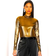 95% Polyester, 5% Spandex Machine Wash Mockneck Styling Gold-Tone Metallic Finish Fall Party Crop Top With Crew Neck, Fall Crew Neck Crop Top For Party, Fall Crew Neck Crop Top For Night Out, Chic Metallic Crop Top For Spring, Metallic Cropped Tops For Spring, Metallic Fitted Tops For Spring, Gold Stretch Crop Top, Sleek Crop Top For Night Out In Spring, Sleek Crop Top For Spring Night Out