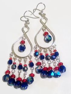 Patriotic Silver Glass  Beaded Red and Blue Fire Czech Crystal  Dangling Chandelier Earrings Fish Hook Nickel Free Perfect for the 4th of July!! These earrings are big and beautiful, without weighing your ears down! They are nickel-free for your comfort. The variety of bright Fired Blue and Bright Red really catches the eye . These lovely chandelier fish hook earrings are one of a kind! You can pair them with Your little black dress for a big splash of color and flash, or a casual blouse and jeans--these are just plain fun and eye catching to wear! All my earrings https://www.etsy.com/shop/TiazasTreasures?section_id=15266317&ref=shopsection_leftnav_2 Everything Else  https://www.etsy.com/shop/TiazasTreasures?ref=shopsection_shophome_leftnav Colors may not be exact due to difference between Beading Design, Wedding Earrings Chandelier, Blue Chandelier, Jewelry 2023, Patriotic Jewelry, Jewelry Holiday, Earrings Wire, Earring Designs, Patriotic Holidays