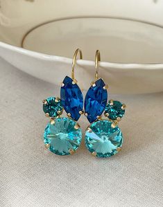 "Gorgeous pair of earrings featuring high quality crystals in shades of blue. 1 1/2\" long x 5/8\" wide. Gold plated settings. Thanks for stopping by!" Blue Bridal Jewelry, Drop Earrings Bridal, Crystal Cluster Earrings, Blue Blossom, Swarovski Crystal Drop Earrings, Something Blue Bridal, Fancy Jewelry Necklace, Bridal Earrings Drop, Blue Bridal