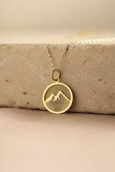 Gold Mountain Pendant - Mountain Gold Necklace ● Material of pendant: Solid Gold 14k ( REAL GOLD ) ● Metal Stamp: 14k ( REAL GOLD ) ● The pendant is available in 5 sizes: - 12,7 mm / 0.5 inches (Diameter) - 14,0 mm / 0,55 inches ( Diameter ) In the photos - 15,3 mm / 0.6 inches ( Diameter ) - 16,5 mm / 0,65 inches ( Diameter ) - 19,1 mm / 0,75 inches ( Diameter ) ( In the photos the size is 14mm / 0.55 inches Diameter ) ( Jump Ring inner diameter: 4 mm ) ● Material of chain: Solid gold 14k ( REA Gold Recycled Gold Jewelry For Gift, Gift Jewelry In Recycled Gold With Hallmark, Personalized Recycled Gold Charm Necklace As Gift, Personalized Recycled Gold Charm Necklace Gift, Personalized Recycled Gold Charm Necklace For Gift, Yellow Gold Medallion Jewelry As A Gift For Her, Personalized Recycled Gold Jewelry As A Gift, Personalized Recycled Gold Jewelry For Gifts, Recycled Gold Round Charm Necklace As Gift