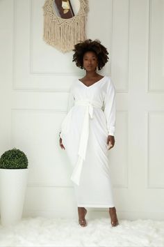 JIBRI Long Sleeved Slouch Maxi Dress  V Neck Long Sleeves Gathered Elastic Waist Attached Wrap Belt Relaxed fit Exaggerated hip drape Mini button closure Fabrication: Jersey Knit Sizing: True to Size (View Size Chart) Handmade in Atlanta, GA Style Notes: Effortlessly stylish and flattering for most body types. Perfect Long White Dress Plus Size, White Plus Size Dresses, All White Party Outfits, Maxi Dress V Neck, White Party Outfit, Sundress Casual, All White Party, Ruched Maxi Dress, White Sundress