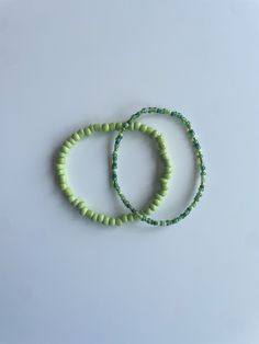 Stretchy bracelet set (2) - lime green medium sized bracelet, multi-green seed bead bracelet These bracelets come in a set of two. They are meticulously handmade with seed beads and stretchy string. The durable bracelets are all triple knotted and glued shut. DISCLAIMER ON RETURN/EXCHANGE POLICY ~ Slightly mis-shaped bracelets due to knotting of the stretchy string is NOT INCLUDED in the return/exchange policy ~ Stretched out bracelets due to use over time is NOT INCLUDED in the return/exchange policy ~ Only broken beads or broken string within the return/exchange policy window ARE INCLUDED in the return/exchange policy Green Beaded Bracelets, Seed Bead Bracelet, Stretchy Bracelets, Seed Bead Bracelets, Bead Bracelet, Seed Bead, Bracelet Set, Arm Band, Beaded Bracelet