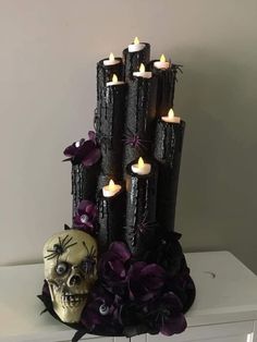 a halloween decoration with candles and a skull