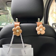 the back seat of a car with two flower decorations on it