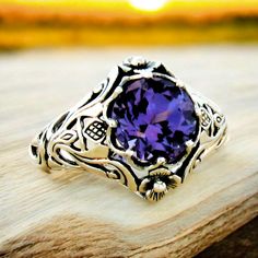 Discover the timeless elegance of our Vintage Scottish Thistle Ring, meticulously crafted from 925 Sterling Silver. This unique filigree jewelry piece features an 8mm color-changing Alexandrite, providing a captivating spectrum of hues. Perfect as a beautiful birthday present, the ring is stamped with 925 for authenticity, ensuring premium quality. Embrace heritage and sophistication with this expert-crafted statement piece, ideal for collectors and admirers of fine jewelry.Introducing our Vintage Scottish Thistle Ring, featuring a color-changing Alexandrite set in 925 Sterling Silver. This meticulously crafted piece showcases intricate filigree detailing and the iconic Scottish thistle design, symbolizing strength and resilience. The unique Alexandrite gem transforms hues under different Ornate Filigree Ring Stamped 925 For Anniversary, Ornate Filigree Ring For Anniversary, Stamped 925, Silver Filigree Amethyst Ring In Sterling Silver, Silver Filigree Amethyst Ring, Silver Sterling Silver Amethyst Ring With Filigree, Sterling Silver Amethyst Promise Ring With Intricate Design, Ornate Sterling Silver Amethyst Ring For Anniversary, Sterling Silver Amethyst Ring With Intricate Design, Oval Sterling Silver Filigree Amethyst Ring