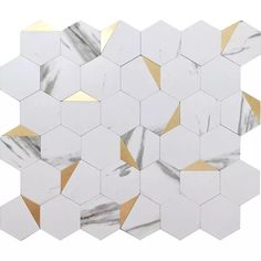 white and gold hexagon marble mosaic tiles on a white background with golden accents