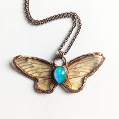 Real Cicada Necklace | Electroformed aurora opal clear wing resin insect crystal pendant oddity ethically sourced jewelry gift rainbow 17 "Rain or shine, the cicadas always find something to sing about." -- Marty Rubin These pendants are made with real BROOD XIX cicada wings, collected after their full natural life cycle in Kentucky. One signature characteristic of periodical (17 and 15 year) cicadas is that their wings are transparent - they also have reddish patterning on their wings and bodies, unlike the common green or black markings from annual broods. Wings are sealed with crystal clear hard resin and electroformed in 100% copper, along with a brilliant aurora opal resembling the northern lights. This piece comes on a 20-inch antiqued copper chain. If you would prefer a different le Cicada Jewelry, Cicada Necklace, Copper Electroformed Jewelry, Butterfly Wing Jewelry, Aurora Opal, Jewelry Drawer, Wing Jewelry, Electroformed Jewelry, Butterfly Wing