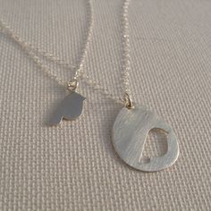 "Mother daughter sterling silver necklace set. A sweet bird silhouette cut from a silver teardrop for mom and matching bird charm necklace for daughter. Presented on a custom MOTHER DAUGHTER quote card that reads: \"If I'm a bird, you're a bird.\" This gift makes the perfect keepsake to last a lifetime. Ideal for new a new mommy or veteran supermom. DETAILS and DIMENSIONS mommy bird pendant: .65\" x .75\" daughter bird pendant: .55\" x .65\" chains: 17\" material: sterling silver All necklaces a Personalized Silver Teardrop Necklace, Sterling Silver Teardrop Charm Necklace For Anniversary, Sterling Silver Teardrop Necklace As Gift For Mom, Sterling Silver Teardrop Necklace For Mom, Sterling Silver Teardrop Pendant Charm Necklace For Anniversary, Anniversary Sterling Silver Teardrop Pendant Charm Necklace, Silver Teardrop Necklace For Mother's Day, Anniversary Sterling Silver Teardrop Charm Necklace, Mother Daughter Quote