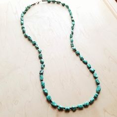 We've got heart eyes for this long turquoise necklace! This long boho necklace is made up of natural turquoise chunks and small wooden beads. This turquoise stone necklace is the perfect item to layer with shorter necklaces and boho statement necklace as shown in the attached pictures. Add this turquoise stone necklace to your unique handmade jewelry collection! Although your handmade beaded necklace will resemble the photo, each piece is created by hand, so no two are identical. Length: 38 inch Cheap Adjustable Turquoise Beaded Necklace, Long Turquoise Necklace, Chunky Turquoise Necklace, Long Boho Necklace, Boho Beaded Necklace, Boho Chic Accessories, Turquoise Beaded Necklace, Long Necklace Boho, Boho Statement Necklace