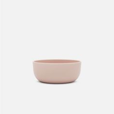 a pink bowl on a white background