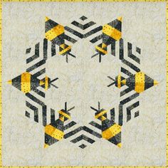 an abstract quilt with yellow and black designs on it's sides, in the middle of