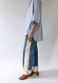 Vintage Reworked Slouch Jean in Indigo and Natural from B Sides. Made from a combination of reworked vintage jeans and natural cream side panels. Mid-rise with a slouchy fit, relaxed hip and wide leg. This style runs 1-2 sizes large, size down one size for the intended slouchy fit and 2 sizes for a more fitted look around the waist. These jeans have a longer inseam and can be worn slouchy, cuffed or you can cut for a raw edge finish like the Lasso. Re-made from authentic vintage Levi's 501's, co Sewing Projects Denim, Jeans With Side Panels, Add Fabric To Jeans, Jane Birkin Jeans, Sewing Clothes Aesthetic, Make Jeans Longer, Jean Diy Ideas, Artistic Fashion Style, Comme Des Garcons Aesthetic