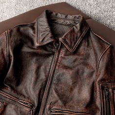 Meet our Men's Red-brown Air Force Flight Vintage Leather Biker Jacket. If you love leather jackets, you’re especially going to love this motorcycle leather jacket! It’s fashionable, comfortable, and multifunctional. Specifications: Collar Type: Stand Collar Pocket Style: Zipper Pockets Colour: Red-brown Style: Fashion Urban Style Style Details: Practical Pockets 2 Exterior Zipped Hand Pockets 1 Exterior Small Zipped Arm Pocket 1 Interior Coin/Lighter Pockets Front Zipper Closure Silver Hardware Rugged Brown Outerwear With Zip Fly, Brown Biker Jacket With Zipper Closure For Outdoor, Brown Moto Leather Jacket With Pockets, Brown Moto Leather Jacket For Work, Moto Style Distressed Brown Leather Jacket, Distressed Brown Leather Biker Jacket With Pockets, Rugged Brown Biker Jacket For Work, Brown Moto Leather Jacket With Zipper Closure, Brown Leather Biker Jacket With Pockets