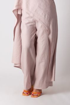 Two Pieces Linen Set. Elegant tunic with Wide Legs Pants. The pants have elastic waist band and 2 sides pockets. The tunic is asymmetric, with a short front and a long back reaching down to the ankle. Top and bottom can be worn separately and combined with various clothes successfully. Made of 100% linen The model wears size M - 5′6″ / 170 cm Casual Asymmetrical Hem Bottoms For Spring, Casual Bottoms With Asymmetrical Hem For Spring, Spring Wide-leg Pants With Side Slits, Chic Baggy Bottoms With Asymmetrical Hem, Spring Loungewear Bottoms With Side Slits, Asymmetrical Hem Bottoms With Pockets For Spring, Spring Bottoms With Asymmetrical Hem And Pockets, Casual Summer Pants With Asymmetrical Hem, Summer Casual Pants With Asymmetrical Hem