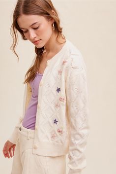 Upgrade your wardrobe with our Pop Floral Sweater Weaved Cardigan, featuring a unique design and high-quality materials that make it a valuable addition to any fashion-forward ensemble. With its intricate weaving and trendy pop floral pattern, this cardigan is sure to elevate your style and make a statement wherever you go. Made with care and attention to detail, it's a versatile piece that offers both warmth and a touch of elegance to complete your look. Details: features: • Pop floral with flo Cream Floral Embroidery Cardigan For Spring, Cream Floral Embroidered Cardigan For Spring, Casual Cream Cardigan With Floral Embroidery, Cream Pointelle Knit Spring Cardigan, Spring Pointelle Knit Long Sleeve Outerwear, White Cardigan With Button Closure For Spring, Spring Long Sleeve Pointelle Knit Outerwear, Floral Cardigan Outfit, Star Sweater