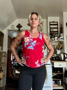 This is perfect and barely worn  1980's Avon brand cherry red tank top with hawaiian floral print  Boxier fit to tank  Thicker straps  Scoops fairly low in the back  Cotton material  Seems barely worn in perfect condition  So vibrant and colorful  Tag is in near perfect condition  Fits a womens medium  Measurements are approximate and taken flat so please double bust and waist for more accurate sizing  Bust: 18 in  Waist: 18 in  Length: 21.5 in  All sales are final  Thanks for checking out Cereal Vintage Thrift  Recycle Reuse Recreate Sleeveless Cotton Top With Tropical Print, Cotton Sleeveless Top With Tropical Print, Summer Sleeveless Hawaiian Tops, Hawaiian Sleeveless Summer Tops, Red Floral Print Tank Top For Vacation, Summer Hawaiian Sleeveless Tops, Red Floral Print Summer Tank Top, Vintage Sleeveless Top For Vacation, Retro Hibiscus Print Summer Tops