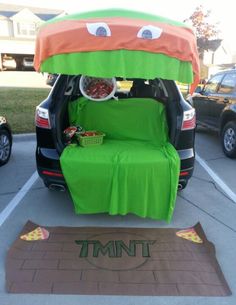 the trunk of an suv is decorated to look like a car with food in it