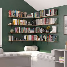 a living room filled with lots of books on shelves next to a couch and table