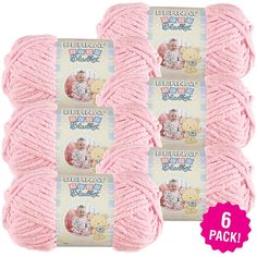 three balls of pink yarn with the words bernat baby written on it in white