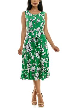 A vibrant printed midi dress is perfect for summer events. Fit: this style fits true to size. 50" length (size Medium) Crewneck Sleeveless Attached waist tie 95% polyester, 5% spandex Machine wash cold Imported Model stats: 5'10", 32" bust, 25" waist, 36" hip. Model is wearing size Medium. Printed Knee-length Midi Dress For Garden Party, Summer A-line Printed Midi Dress, Knee-length Printed Sundress, Printed Knee-length Summer Midi Dress, Spring Knee-length Printed Midi Dress, Summer Knee-length Printed Midi Dress, Printed Knee-length Midi Dress For Spring, Casual Belted Sleeveless Summer Dress, Casual Belted Sleeveless Dress For Summer