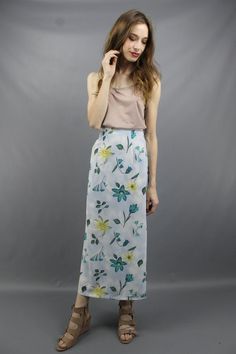 Vintage nineties BLUE FLORAL MAXI SKIRT. Partial elastic waist. Back zipper + button. 17 inch slits on both sides.Model is 5'9. Her measurements are: bust=34 inches, waist=26 inches, & hips=34 inches. The skirt fits as shown on her.We measure on a flat surface from seam to seam. Bust, waist, & hip measurements have already been doubled. We suggest you compare our measurements to a garment you already own and know fits you well to ensure a proper fit.label: rikki j new york approximate si High Waist Floral Print Maxi Skirt, High Waist Floral Print Maxi Skirt In Relaxed Fit, High Waist Relaxed Floral Maxi Skirt, High Waist Floral Print Relaxed Skirt, High Waist Relaxed Fit Pencil Skirt For Spring, Spring High Waist Lined Wrap Skirt, High Waist Spring Wrap Skirt With Lining, High Waist Fitted Wrap Skirt For Spring, Spring Lined Pencil Maxi Skirt