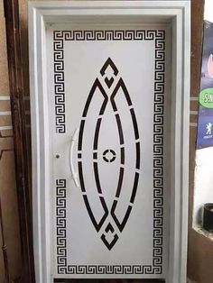 a white door with an intricate design on it