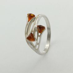 This is a beautiful Baltic Amber Ring in 925 Sterling Silver. The Amber is right from the capital of amber and silver: the city of Gdańsk / Danzig in Poland. The ring is made out of solid 925 Silver and there is no nickel or other substances causing most allergies in the silver. This makes the ring hypo allergenic. Size of the Amber 3 x 0.4 x 0.4 cm 3 x 0.16 x 0.16 inch You will receive the item in a gift box - perfect to surprise someone or yourself. Usually we ship on the same day we receive the payment for the order. We want you to be happy with your purchase. If you do not like what you bough can send it back and we will refund you the money. Please do not hesitate to contact us so we can solve any issue you might have. Nothing is more important than a happy customer. Amber Ring, Baltic Amber, Cognac, Amber, 925 Silver, Jewelry Watches, Jewelry Rings, Fine Jewelry, 925 Sterling Silver