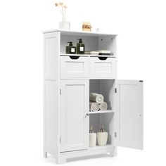 a white cabinet with two doors open and towels on the top shelf next to it