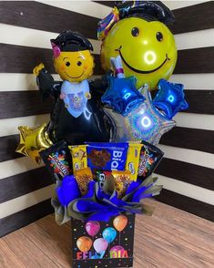 a birthday gift basket with balloons, heliums and other items for someone's special occasion