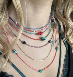 Whole sale 6 pieces daily boho necklace.Made from afghan heishi beads,turquoise and coral chipstone,freshwater pearl,hematite spacer beads.Finished gold plated clasp &extender chain. Necklace lenght 1-pink long: 24 inches +1'' extender chain 2-colorful  : 20.5 inches+1'' extender chain 3-navyblue&pearl: 15 inches+1''extender chain 4-green-red-pink-turquois&pearl: 15.75 inches+1''extender chain 5-turquoise+coral: 15 inches+1''extender chain 6-blue-green-red: 16 inches+1''extender chain Bohemian Heishi Beads Turquoise Necklace Gift, Adjustable Bohemian Turquoise Necklace With Heishi Beads, Bohemian Tiny Beads Turquoise Necklace For Beach, Handmade Bohemian Turquoise Necklace With Heishi Beads, Bohemian Turquoise Necklace With Tiny Beads For Beach, Red Bohemian Necklace With Heishi Beads, Bohemian Turquoise Necklace With Colorful Heishi Beads, Bohemian Multi-strand Heishi Beads Necklaces, Handmade Turquoise Heishi Beads Necklace