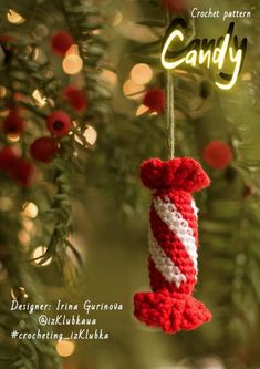 a crocheted candy ornament hanging from a christmas tree