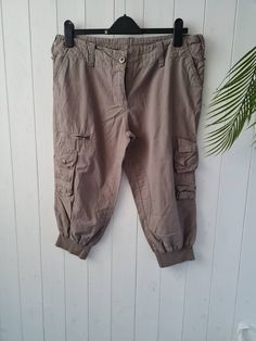 "Cropped cuffed pedal pusher cargo pants Lots of pockets, zips, low rise  Summer trousers Check measurements: Size UK12 US8 100% cotton By Papaya Measurements: Waist 34\" (low waist ) Hips 42\" Rise 9\" Inside leg  19.5\" Good pre-loved vintage condition  All orders are shipped using biodegradable and recycled packaging where possible" Cropped Cargo Pants, Summer Trousers, Pedal Pushers, Womens Capris, Beautiful Blouses, Cropped Trousers, Recycled Packaging, Low Waist, Online Retail