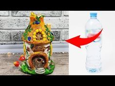 a water bottle with an image of a house on it next to a photo of a birdhouse