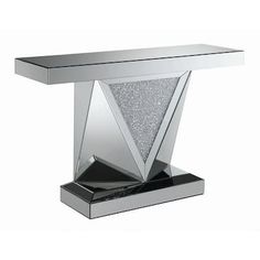 the modern console table is made from stainless steel and has a glass top with silver glitter