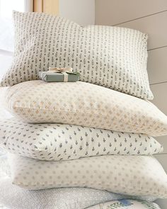 four pillows stacked on top of each other