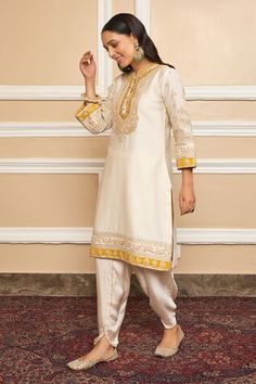 Daisy ivory short kurta with Kashmiri tilla, gota applique embroidered yoke in floral pattern. Paired with dhoti pant. - Aza Fashions Off White Dabka Sets For Festivals, Off-white Sets With Dabka For Festivals, Traditional Off White Salwar Kameez With Dabka, Off White Raw Silk Sets For Eid, Traditional Cream Sets With Dabka Detail, Bollywood Dabka Embellished Off-white Sets, Cream Sets With Dabka For Diwali, Cream Dabka Sets For Diwali, Off White Dabka Sets For Diwali