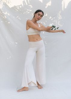 Inspired by the moving and evolving body, giving you comfort and effortless style no matter the stage of your female form. We bring to you, our cherished Layla Flares, made sustainably with love and the intention for all bodies to simply be. Perfect for Yin, Meditation, flowy movement and your everyday comfort. Moulds to the unique contours of your body, feeling like a soft second skin. Soft & stretchy plant viscose is a favourite for new and expecting mums. Gradually Flared for a flowing silhou White Flare Pants, Flattering Pants, White Flares, Slow Fashion Brands, Flowy Pants, Yin Yoga, Black Bralette, Yoga Shop, Simply Be