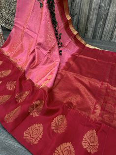 Gorgeous pink brocade pure silk handloom saree with a contrast red border. -Blouse fabric included. -Fall attached. Note:  - Slight inconsistency in weaving is inherent to handloom sarees and is not a defect. -The color of the products may slightly vary according to the ambient lighting conditions and the color calibration of LED devices. If you would like more clarity before your purchase, please drop us a message . Pink Handloom Tissue Silk Saree, Pink Tissue Silk Handloom Saree, Red Tissue Silk Traditional Wear With Pallu, Pink Tissue Silk Saree For Celebration, Red Tissue Silk Saree With Self Design, Red Self Design Tissue Silk Saree, Red Self-design Tissue Silk Saree, Red Tissue Silk Saree For Traditional Ceremonies, Transitional Red Tissue Silk Saree