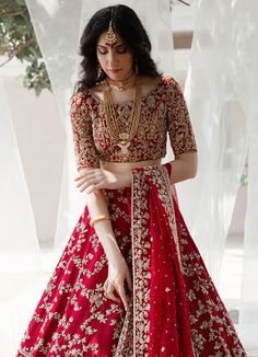 Ceremonial Lehenga In Art Silk With Intricate Embroidery, Traditional Red Festive Gown, Red Lehenga With Intricate Embroidery For Eid, Red Kundan Lehenga For Eid, Festive Kundan Gown For Traditional Ceremonies, Ceremonial Festive Resham Embroidered Choli, Silk Choli With Intricate Embroidery For Traditional Ceremonies, Silk Thread Embroidered Choli For Traditional Ceremonies, Red Silk Thread Lehenga For Navratri