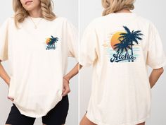 This stylish beach shirt is perfect for celebrating your holiday dreams and summer vacations. It's a comfortable and stylish option to wear at the beach during your summer vacation, on nature hikes, or any outdoor activity. M A T E R I A L S → All our simple color ones like White and Black are 100% Cotton. → All our Heathered Colors are cotton/polyester blend and they are super comfy soft! → Short Sleeve Crew-Neck Unisex T-Shirt → Soft and High-Quality Fabric → Sueded Jersey → Pre-shrunk → Taped shoulder-to-shoulder → Tear away label → Side Seamed → Retail fit S I Z E → We have size chart on our listing photos. S H I P P I N G & P R O D U C T I O N T I M E → Production time is 1-3 business days (depending on proof approval). → Shipping Time is 1-5 Business Days. → If you are in a RUSH, Ple Vacation Hawaiian Shirt With Relaxed Fit, Hawaiian Relaxed Fit Shirt For Vacation, Relaxed Fit Hawaiian Shirt For Vacation, Summer Shirt With Tropical Print For Vacation, Tropical Vacation Shirt With Relaxed Fit, Tropical Camp Shirt With Palm Tree Print For Vacation, Tropical Palm Tree Print Camp Shirt For Vacation, White Tropical Print T-shirt For Vacation, Relaxed Fit Beachy Hawaiian Shirt For Vacation